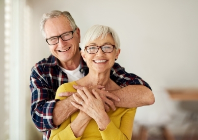 Senior Couple Smiling and Hugging